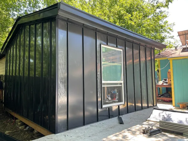 Black standing seam metal wall panels for Roof Inspection in Tulsa