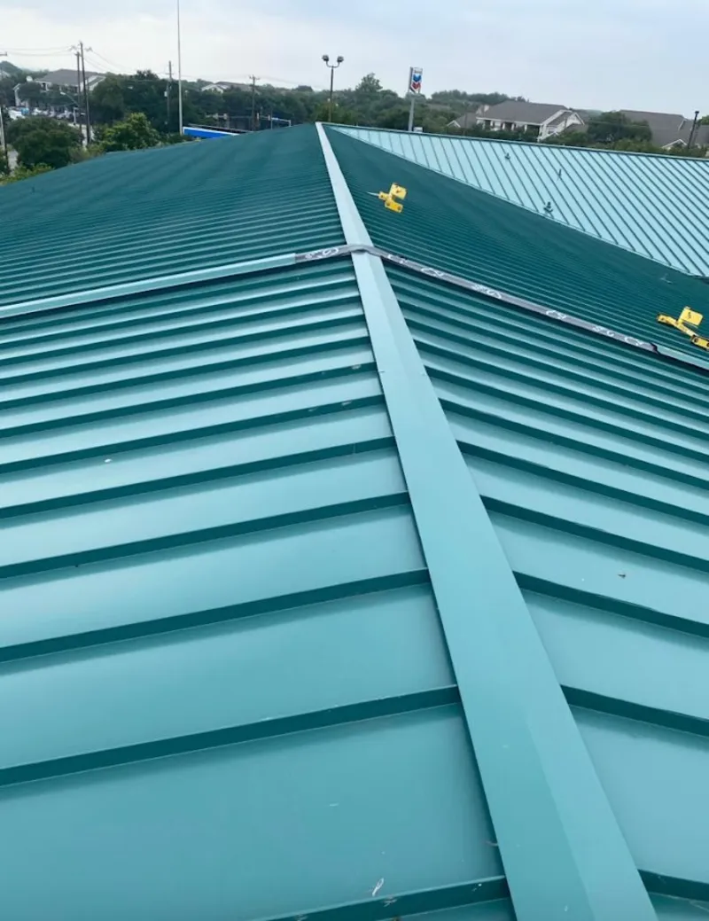 Green commercial metal roof ridge and valley for Metal Roof Repair in Tulsa